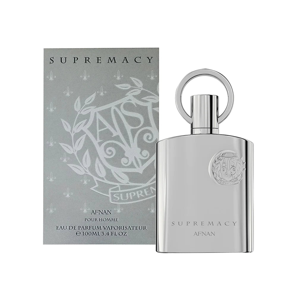 Silver perfume bottle and packaging with 'Supremacy' branding on a white background